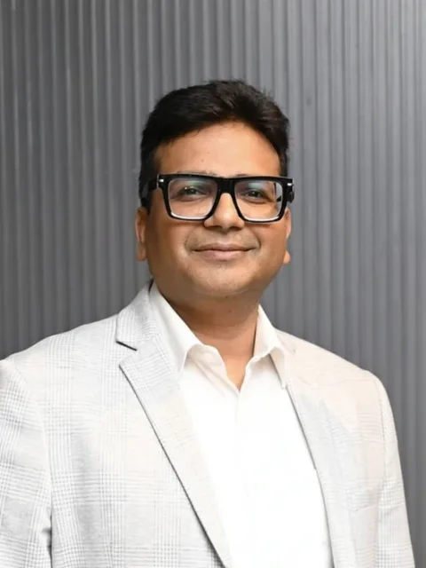 Nirmal Bansal, Founder & CEO of iVentures Wealth, in a light grey blazer